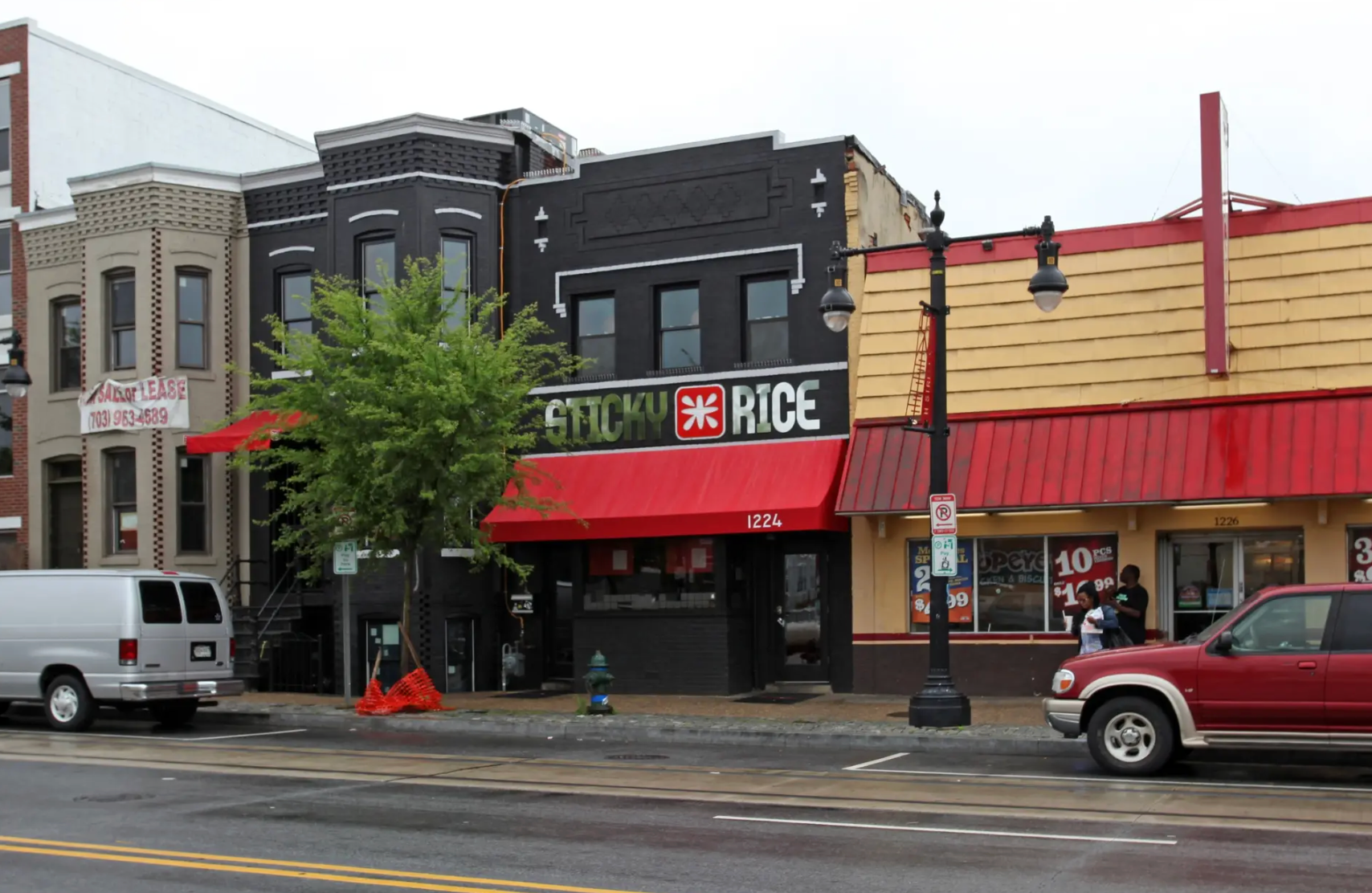 A blurry picture of a clothing store with clothes on display.