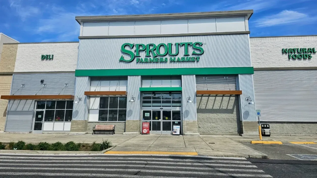 A sprouts grocery store is located in a shopping mall.