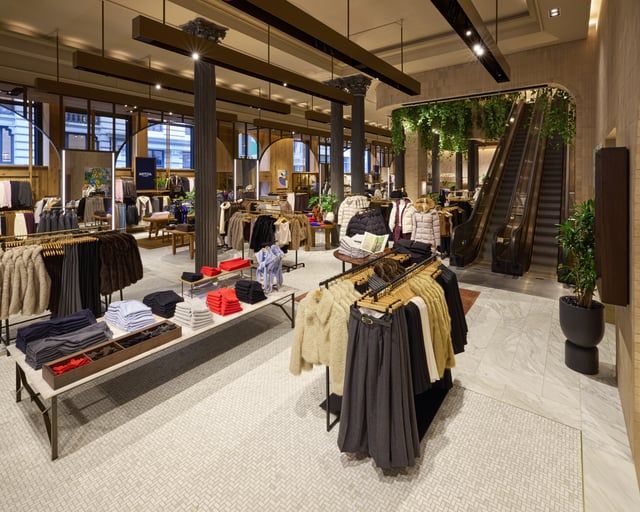 The front of an aldi store with a sign in front of it.