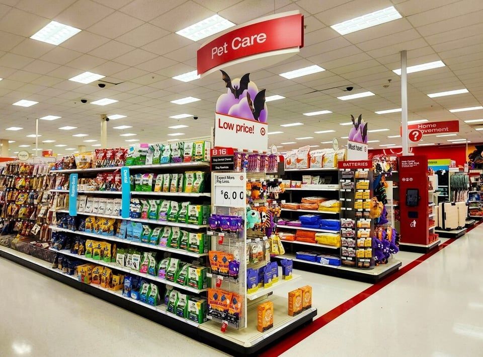 The front of an aldi store with a sign in front of it.