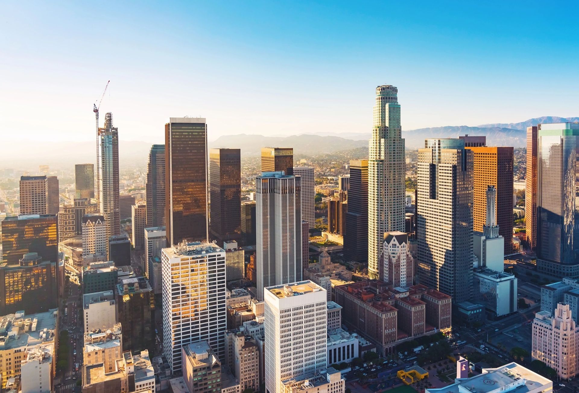 An aerial view of a city skyline with lots of tall buildings.