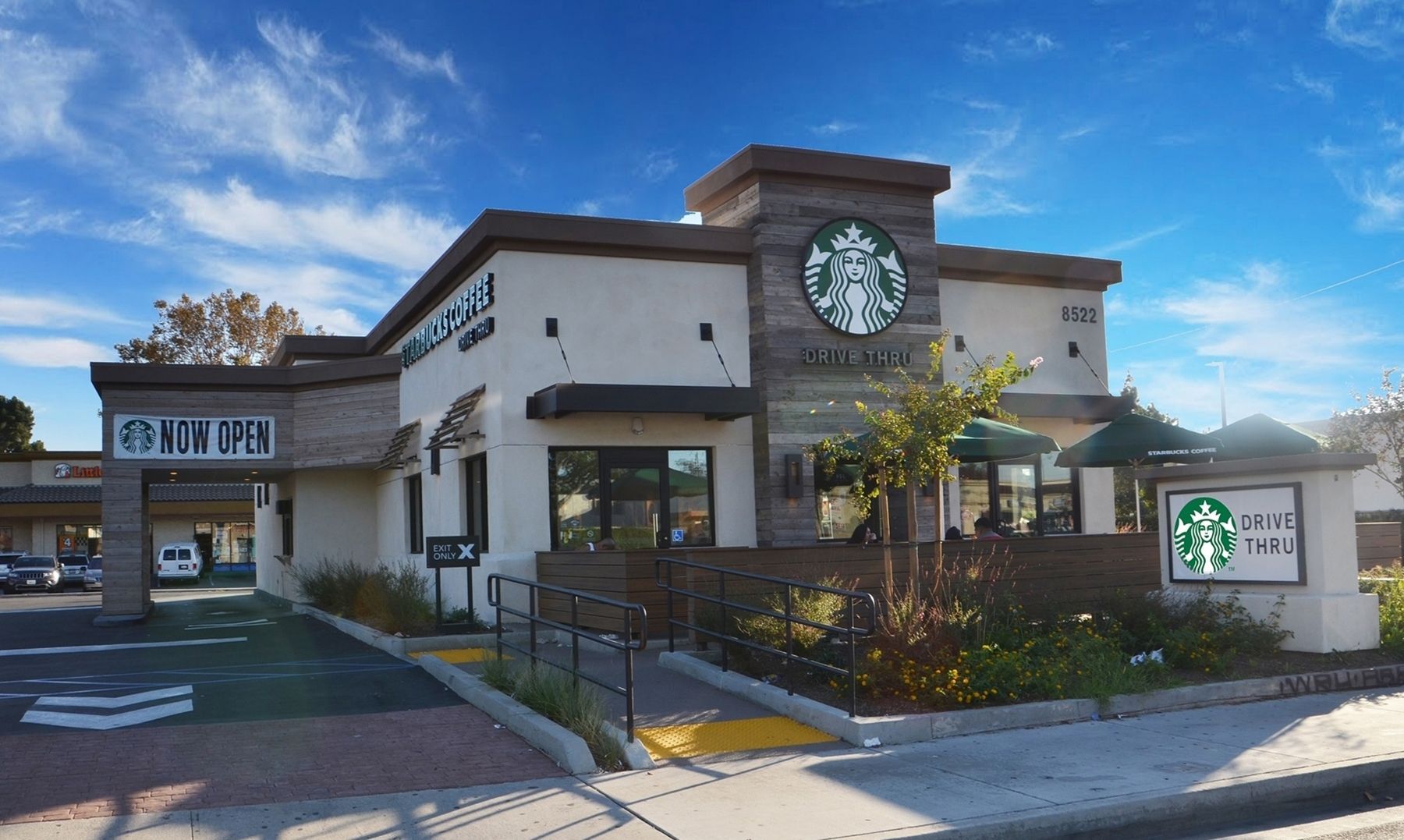 A starbucks coffee shop is located in a shopping center