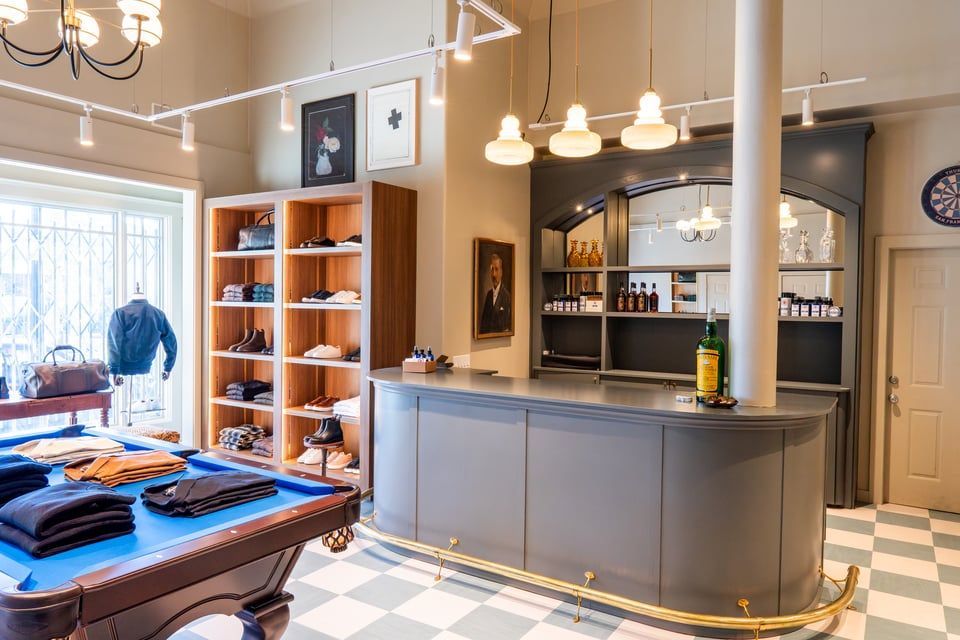 The front of an aldi store with a sign in front of it.