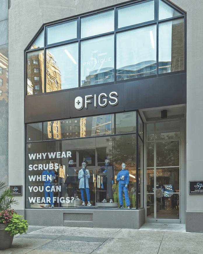 A store front with a sign that says why wear scrubs when you can wear figs