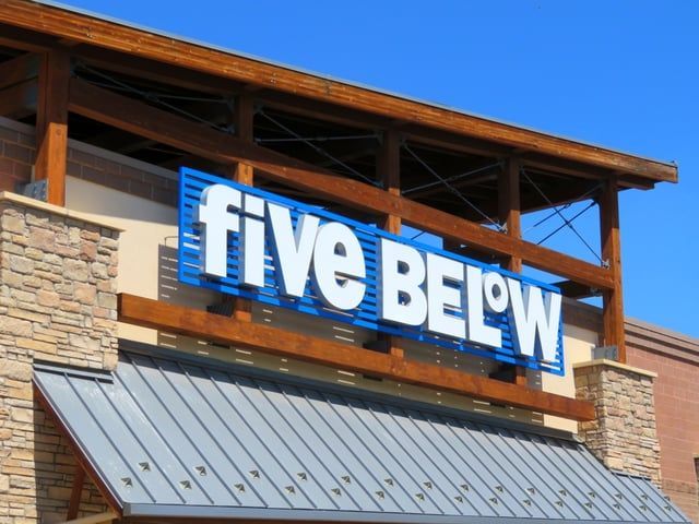 A building with a sign that says five below