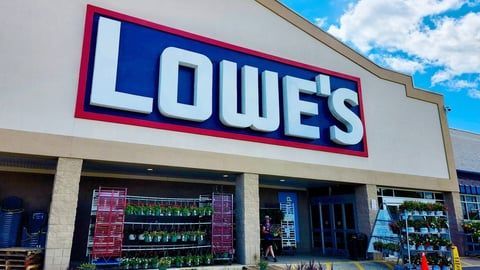 A car is parked in front of a sign that says 223