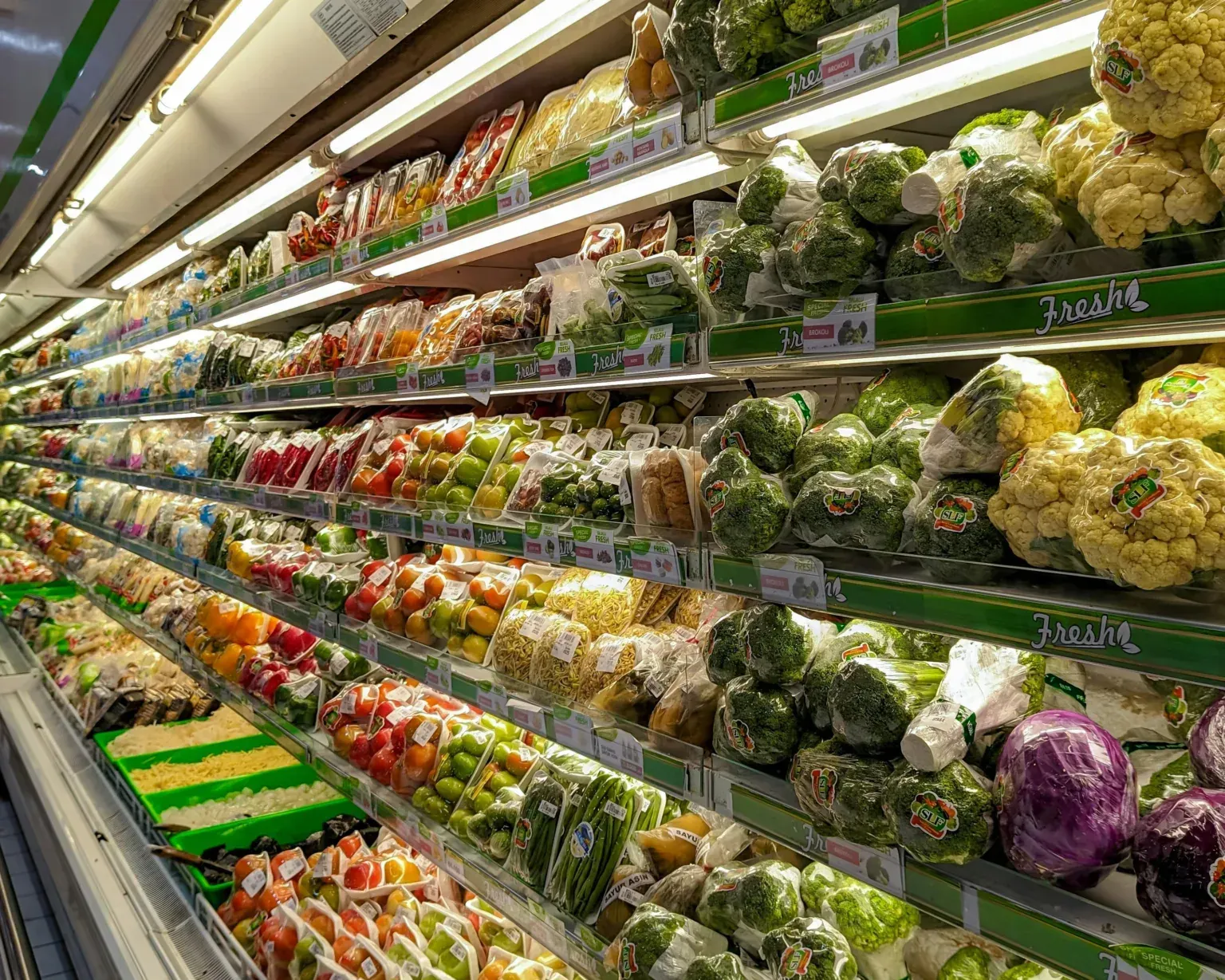 The front of an aldi store with a sign in front of it.