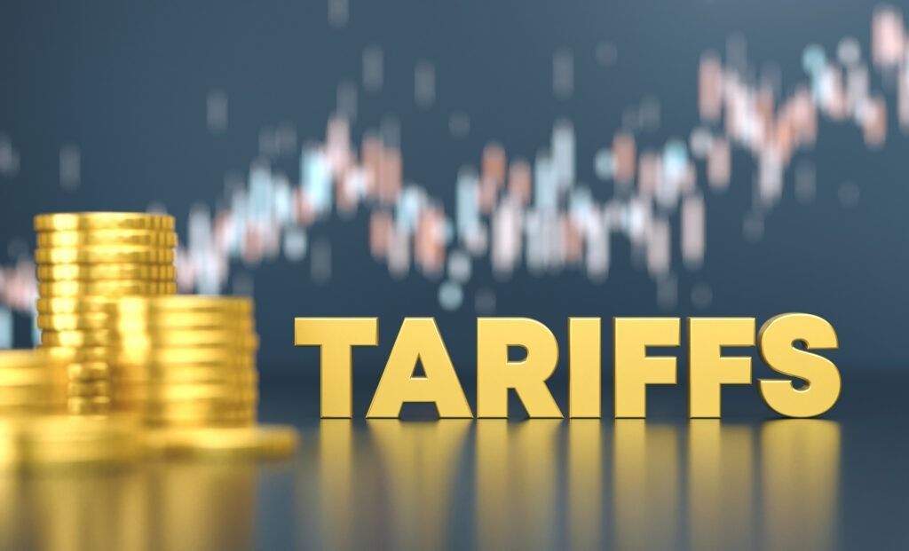 A stack of gold coins next to the word tariffs.