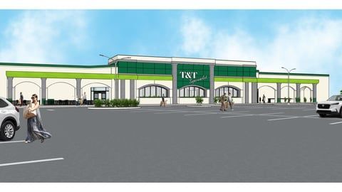 The front of an aldi store with a sign in front of it.