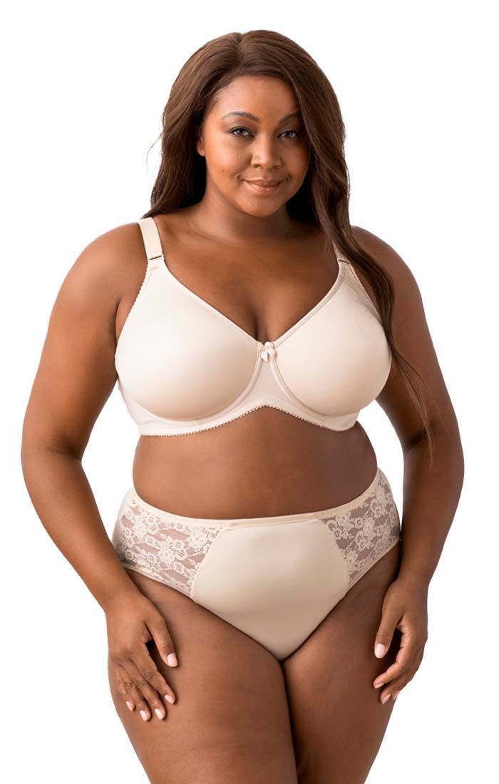 A plus size woman is wearing a bra and high waisted underwear.