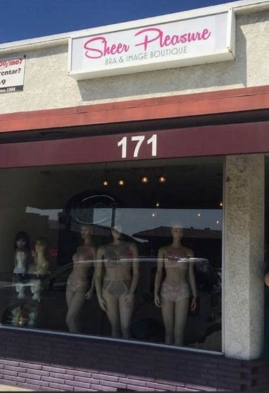 A store front with a sign that says sheer pleasure