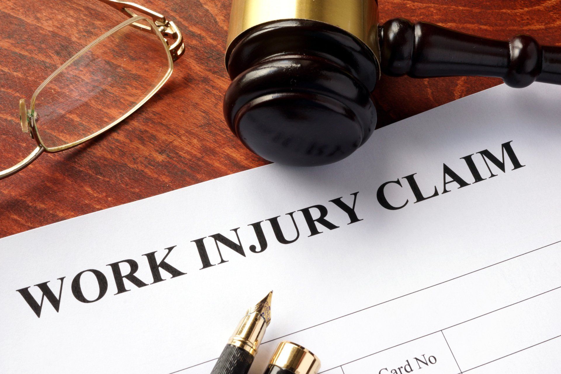 Work Injury Form with Gavel — Susanville, CA — Riley Law Offices
