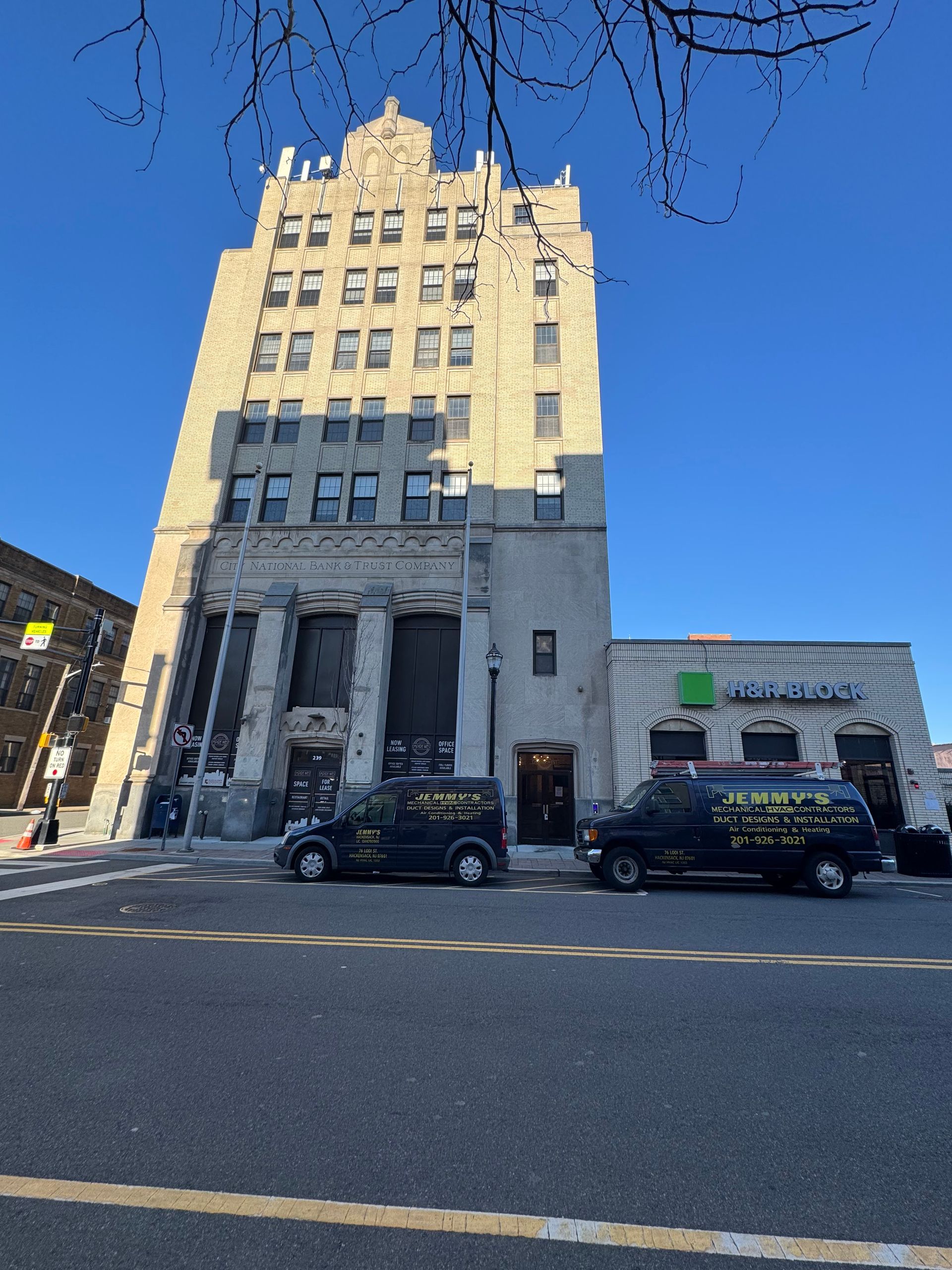 A large building with a van parked in front of it