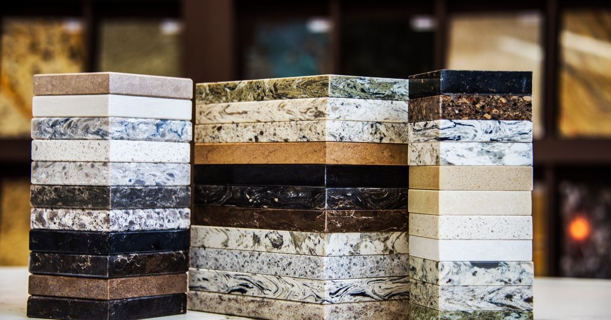 Stacks of different sample materials for countertops. The samples are in three stacks of various colors.