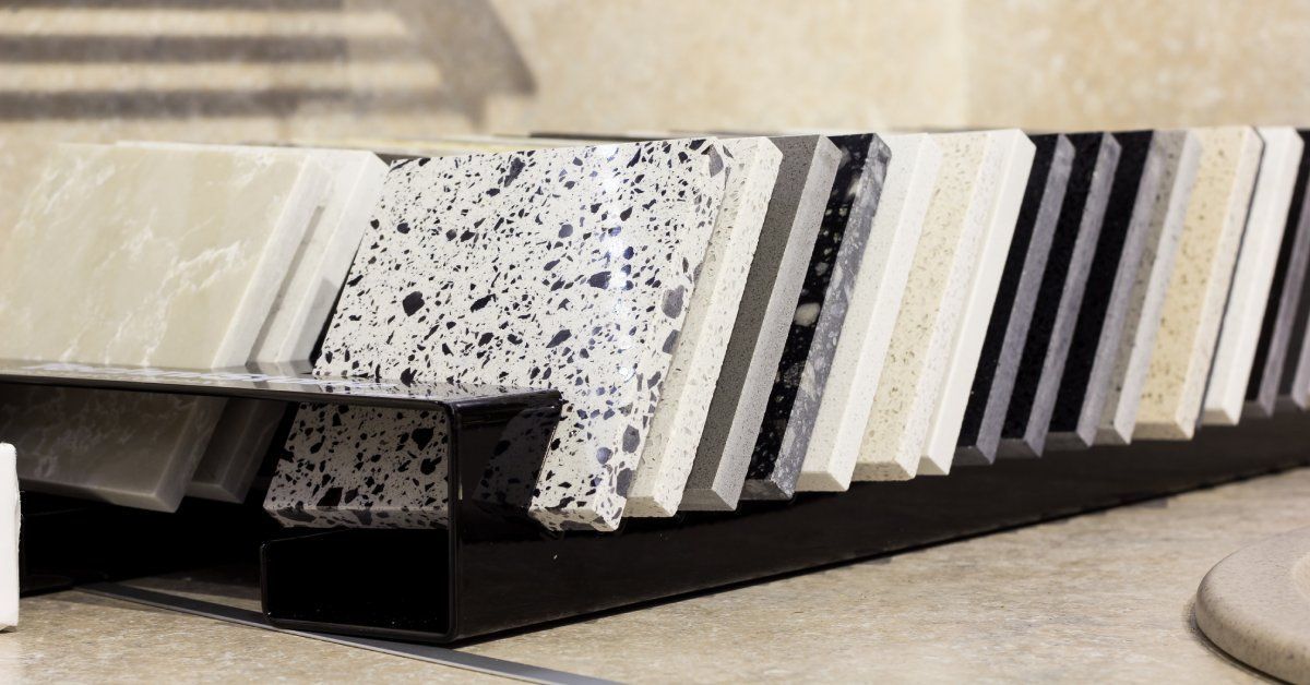A large collection of quartz samples neatly lined up. The samples are cut into small square pieces.