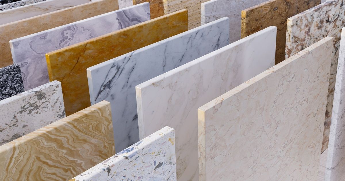 Three rows of stone counter samples. The stone samples vary in color, ranging from dark shades to bright shades.