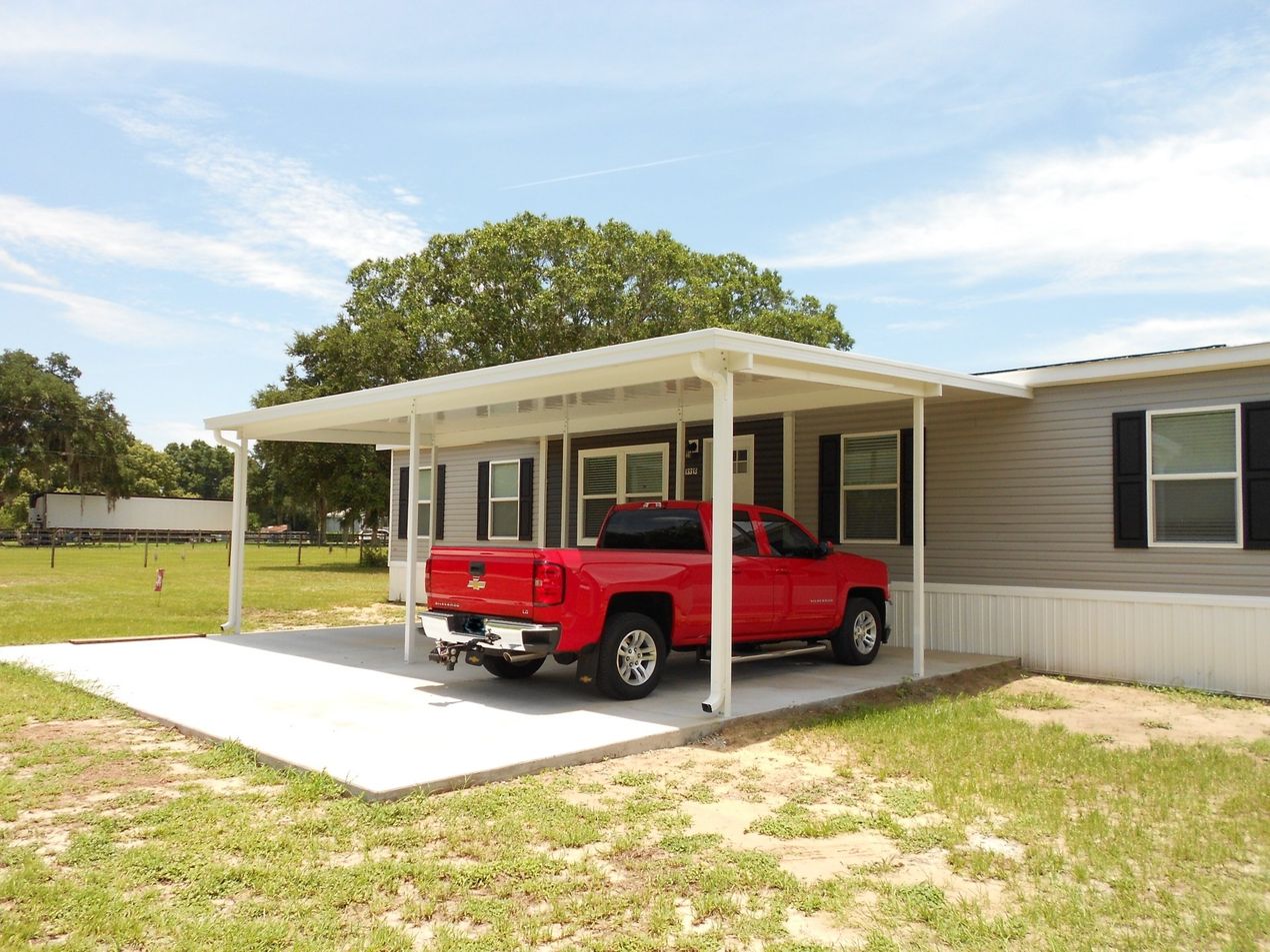 Awning and Aluminum - House with Red Car in Plant City, FL