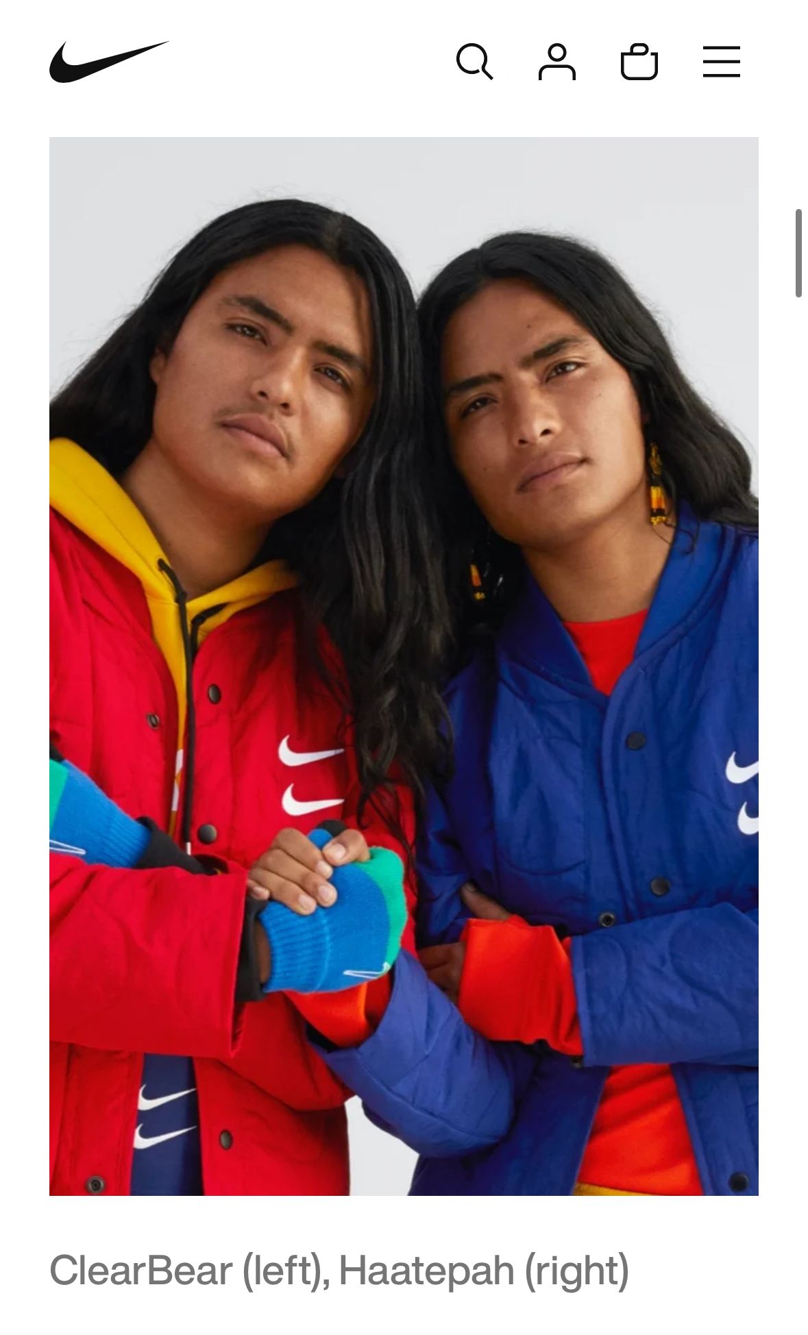 Two people wearing Nike jackets. Red and blue jackets, white swoosh, gloves.