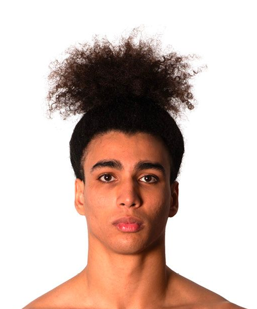 Young person with dark, curly hair in a high bun.