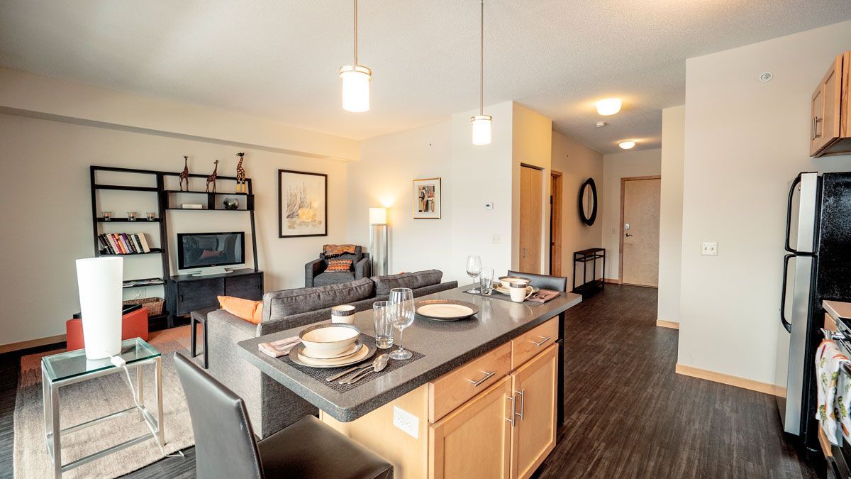A kitchen with a large island in the middle of the room.