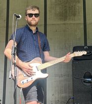 Daniel White playing the guitar.