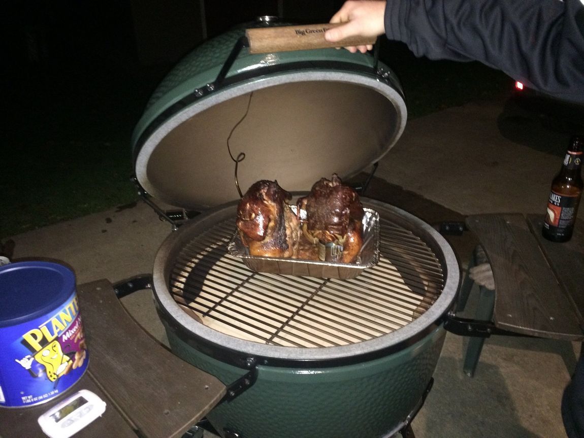 A can of peanut butter sits on a table next to a grill