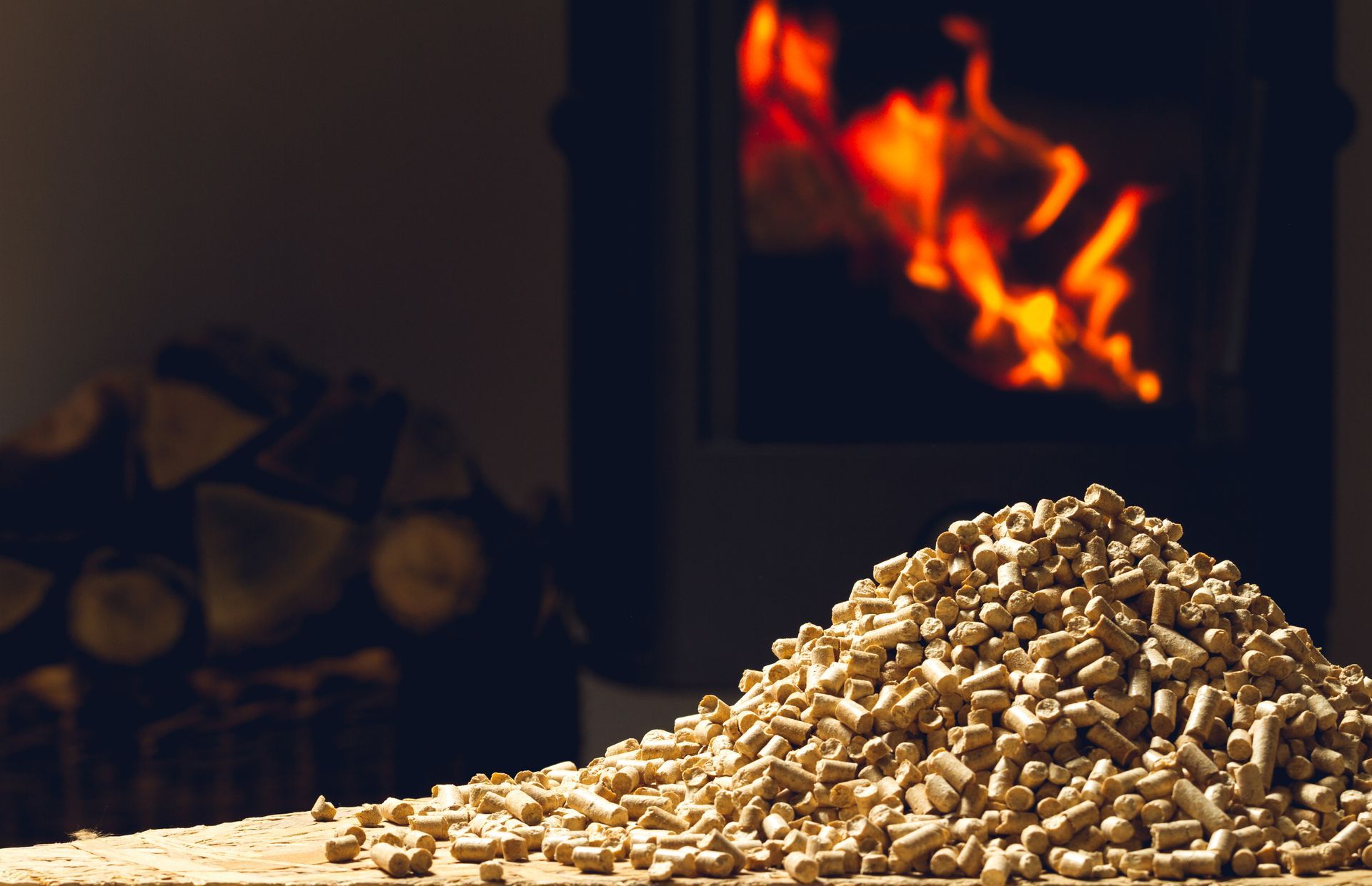 A pile of wood pellets is sitting in front of a fireplace.