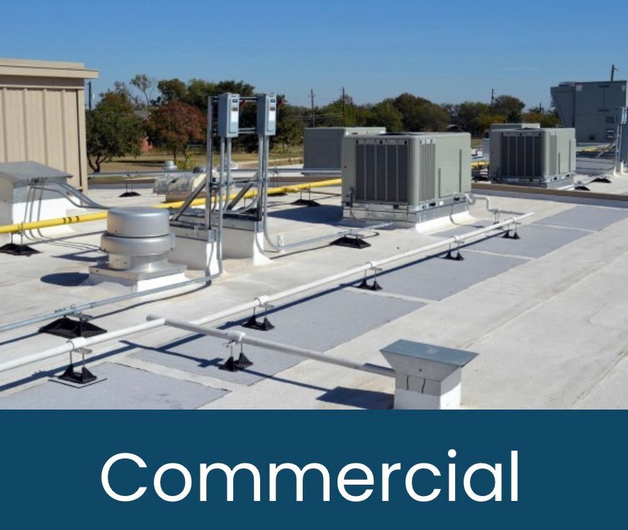 Commercial rooftop with HVAC units and various equipment.