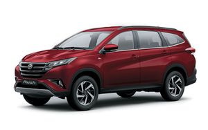 Toyota Rush in a vibrant red color, equipped with a gasoline engine, available for car rental in Palawan, Philippines.