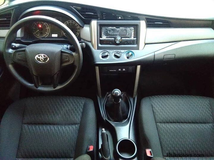 Toyota Innova, with a spacious interior perfect for accommodating 7 people, available for car rental in Palawan.
