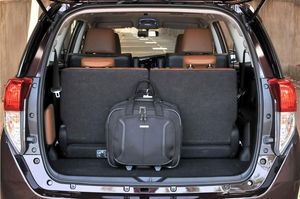 Toyota Innova with a spacious trunk, perfect for road trips, available for car rental in Palawan.