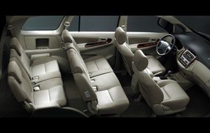 Toyota Innova 2.5 diesel with manual transmission, offering comfortable seating for 7 passengers and a good interior, available for self-drive rental in Palawan.