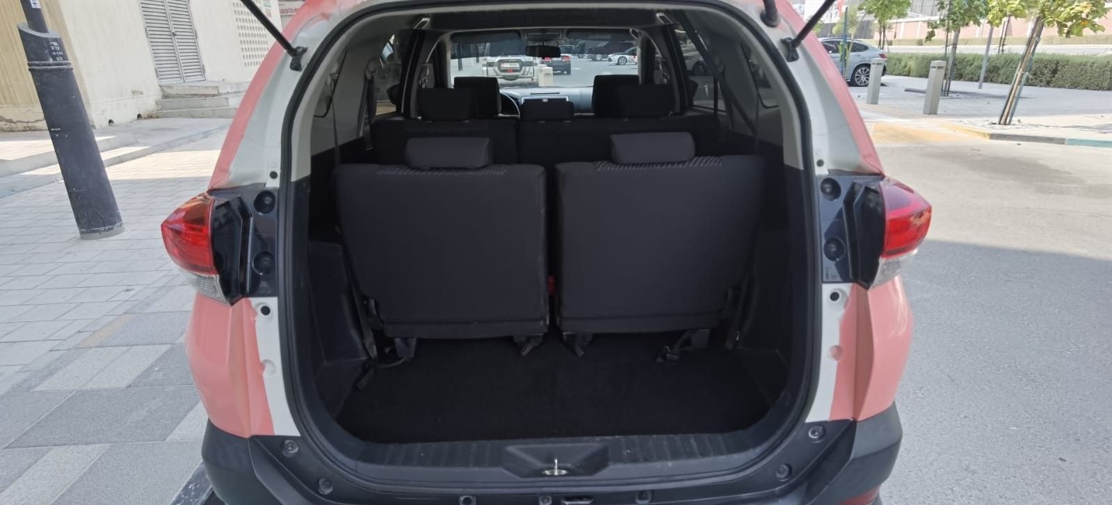 Toyota Rush with a spacious trunk, providing ample storage space for your belongings, available for rental in Palawan.