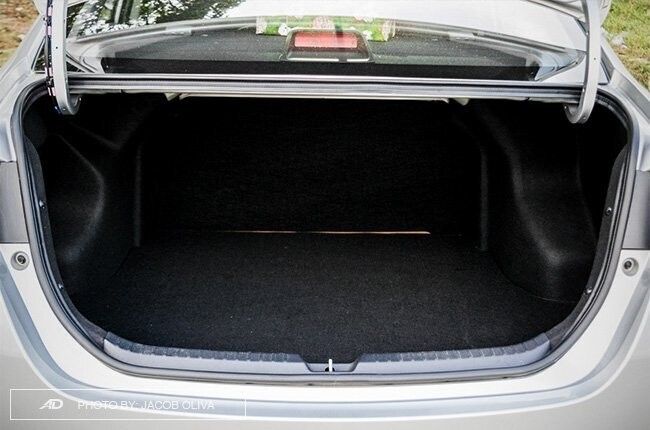 Toyota Vios with a spacious trunk, available for self-drive rental in Palawan, offered by a car rental service in Puerto Princesa, Philippines.
