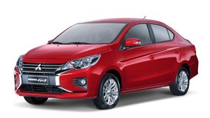 Mitsubishi Mirage in red, ready for self-drive in Palawan, specifically in Puerto Princesa, Philippines, available for hire through a car rental service.