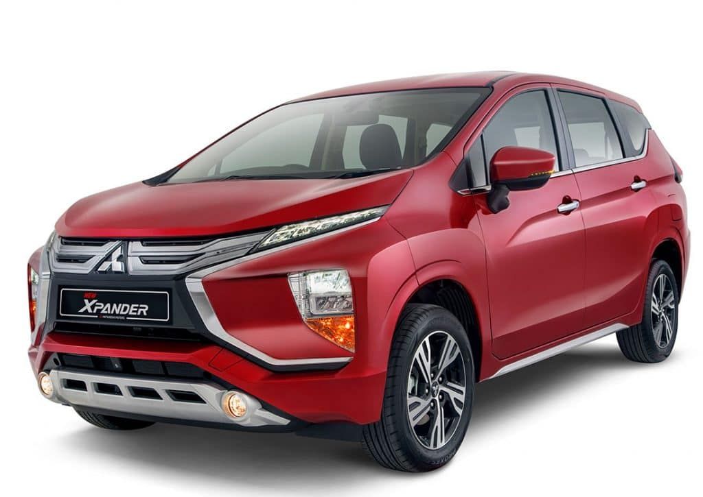 Mitsubishi Xpander in a stylish red color with low clearance, perfect for city drives, available for car rental in Palawan.