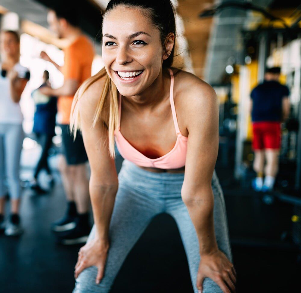 Woman in a Gym Smiling— Fat Burners in Dapto, NSW