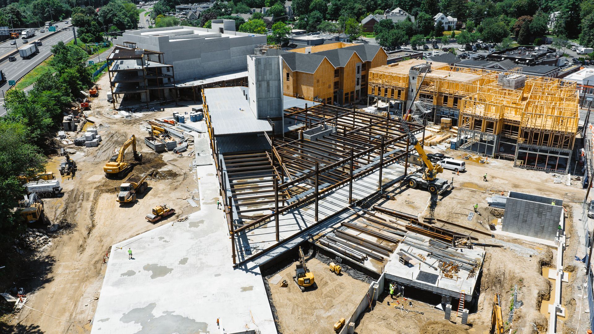Construction site with steel frame of a building in progress.
