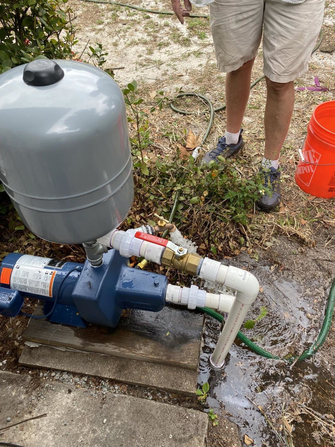 Worker Repairing Water Pump