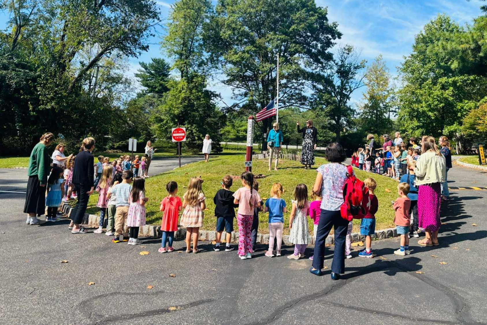 Montessori children lying on floor doing math work with dice