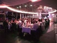 A large cruise ship is floating on top of a body of water.