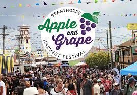 Stanthorpe Apple and Grape Harvest Festival: crowds, buildings, and a festival logo.