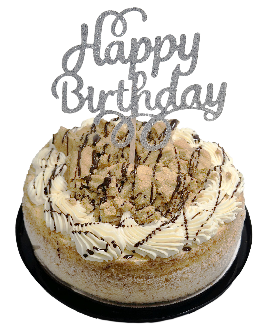 A cheesecake with a happy birthday cake topper on top of it.