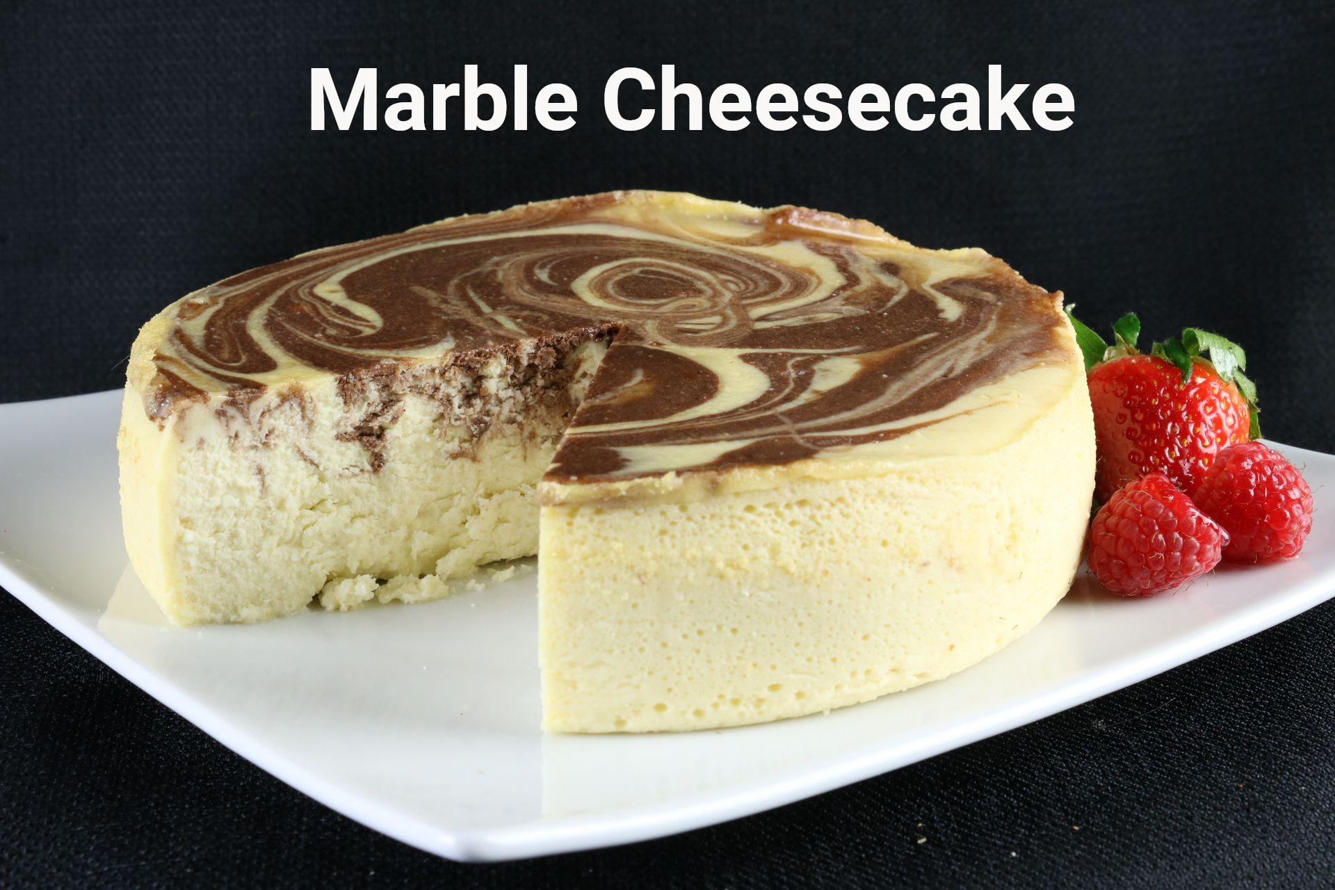 A cheesecake with strawberries on a white plate