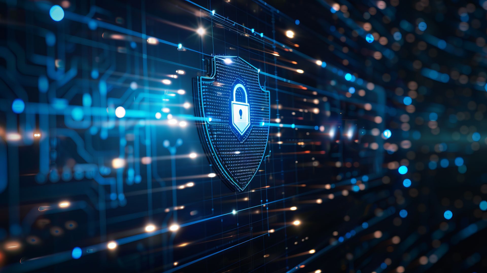 Digital shield icon with a padlock set against a circuit board background with glowing lines and lights.