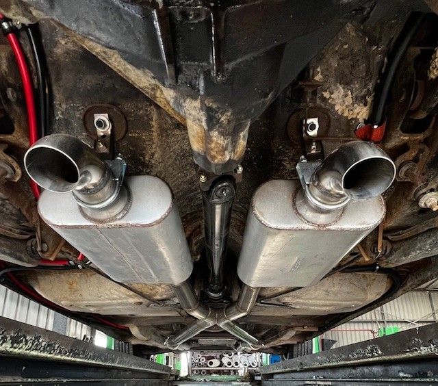 Undercarriage View of a Classic Car Exhaust System — Gladstone Mufflers & Suspension In Gladstone Central, QLD