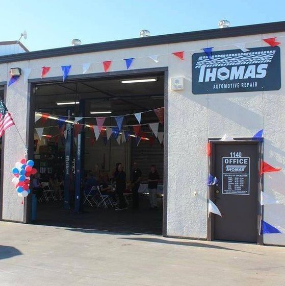 A view of the shop at Thomas Automotive with grand opening streamers