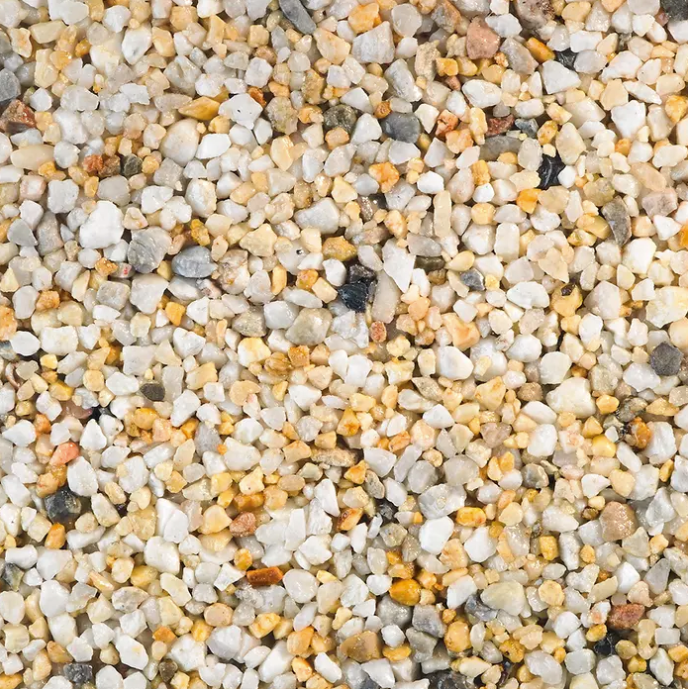 Close-up of small, mixed-color pebbles: white, yellow, gray, and tan.