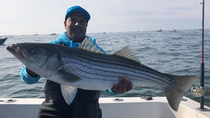 man carrying a big fish