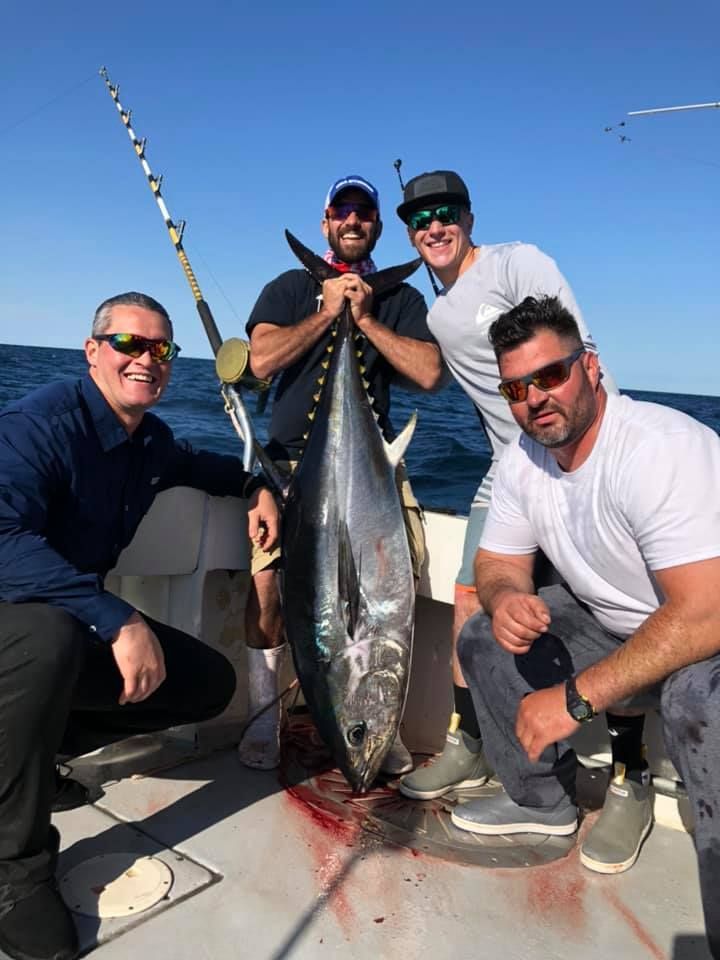 four men showing their big catch
